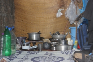 The inside of a typical tent ​occupied by a patient on the pavement. ​Besides luggage, patients bring along utensils from their villages to cook food for their families. Their first acquisition in Mumbai is often some plastic bottles, used to store water filled from nearby taps.